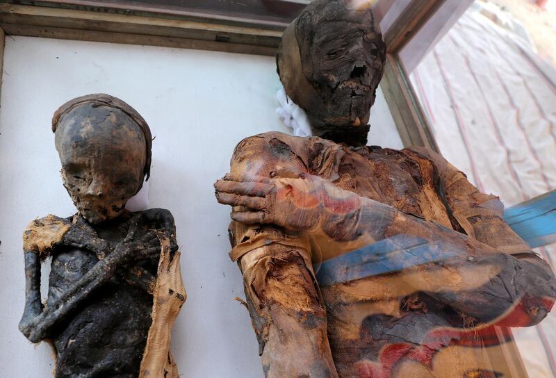 Two mummies, of a woman and child, are on display at the newly discovered burial site, the Tomb of Tutu, at al-Dayabat, Sohag, Egypt April 5, 2019. REUTERS/Mohamed Abd El Ghany