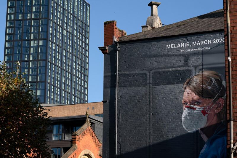 A new mural of a healthcare worker in Manchester. AP Photo