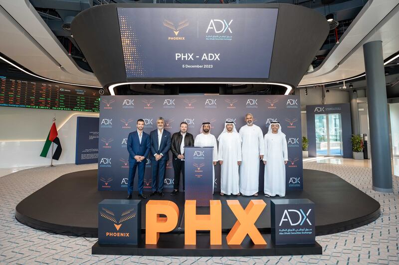Executives from Phoenix and the Abu Dhabi Securities Exchange during the company's trading debut on Tuesday. Photo: ADX