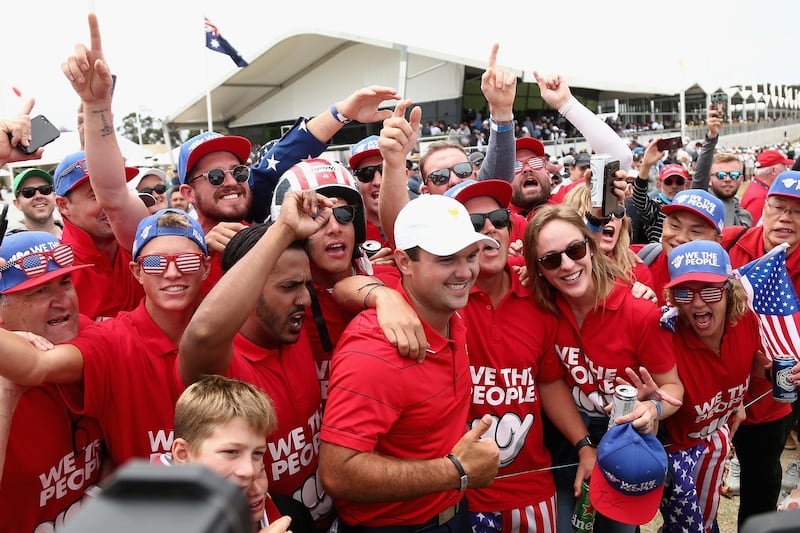 Patrick Reed (C) of the USA team celebrates with fans  at the Royal Melbourne Golf Club in Melbourne. EPA
