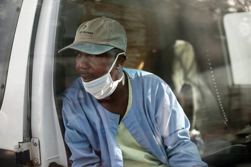 First responder Gordon Kamara waiting in the ambulance.