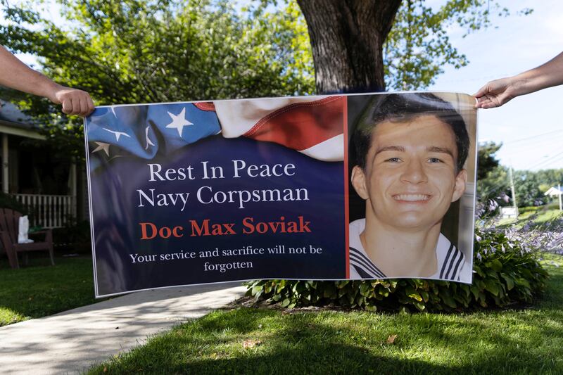 Community members hold a sign honouring Max Soviak in Berlin Heights, Ohio. Reuters