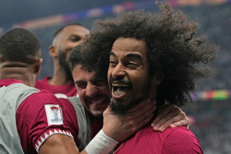 Qatar's Akram Afif celebrates after scoring his third goal. AP 