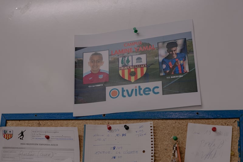 A poster at the La Torreta Football Club shows a photo of Lamine Yamal when he played for the club as a junior. Photo: Hannah Cauhepe for The National
