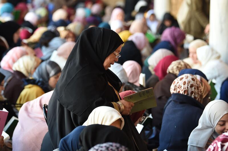Tunisian Muslim women read verses in the praise of Prophet Mohammed as believers celebrated the birthday of Islam's prophet, known in Arabic as "al-Mawlid al-Nabawi", at the historic Zaituna mosque in central Tunis. AFP