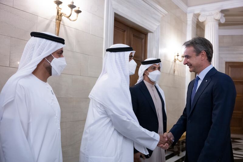 Sheikh Zayed bin Mohamed is greeted by Mr Mitsotakis during a reception at the Maximos Mansion, alongside Sheikh Mohammed bin Hamad, Adviser for Special Affairs at the Presidential Court (L), and Sheikh Mansour bin Zayed, Deputy Prime Minister and Minister of Presidential Affairs (3rd L). 
