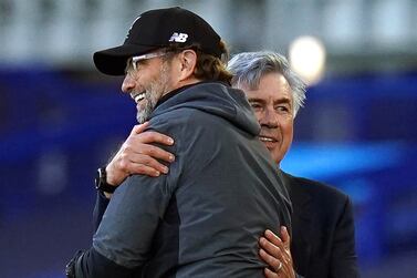 (FILE) - Liverpool's manager Juergen Klopp (L) greets Everton's manager Carlo Ancelotti (R) after the English Premier League soccer match between Everton FC and Liverpool FC in Liverpool, Britain, 21 June 2020 (re-issued on 05 May 2022).  Liverpool FC will face Real Madrid in the UEFA Champions League final on 28 May 2022 at Stade de France in Saint-Denis, near Paris, France.   EPA / PETER POWELL