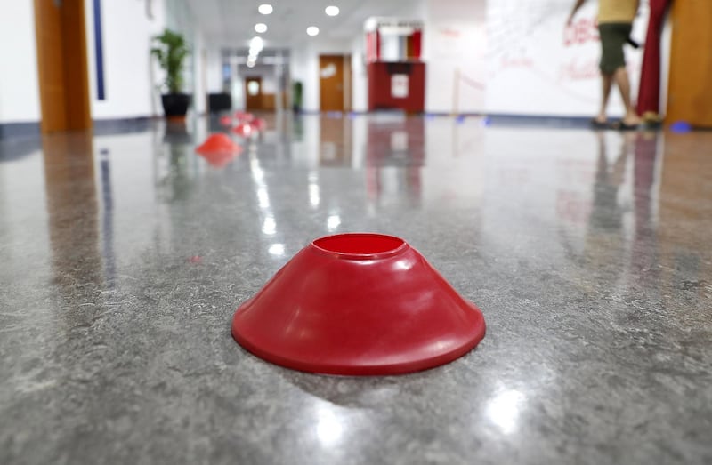 DUBAI, UNITED ARAB EMIRATES , August 9 – 2020 :- Marking for the queue in the corridor for the Covid 19 safety measure at the Dubai British School in Jumeirah Park in Dubai. New Covid safety setup in different areas of the school such as hand sanitizer , safety message, social distancing stickers pasted on the floor, thermal cameras will be installed at the entrance of the school. School will open on 30th August. (Pawan Singh / The National) For News/Online/Instagram. Story by Kelly