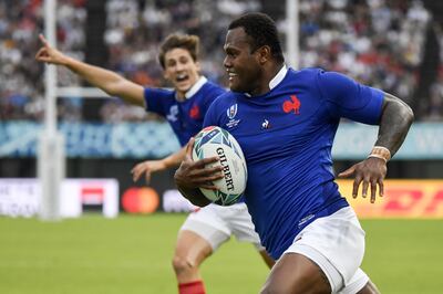 TOPSHOT - France's centre Virimi Vakatawa scores a try during the Japan 2019 Rugby World Cup Pool C match between France and Tonga at the Kumamoto Stadium in Kumamoto on October 6, 2019. / AFP / CHRISTOPHE SIMON
