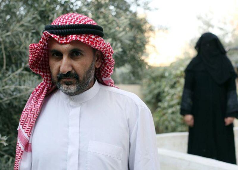 The Jordanian matchmaker Jaser al Ghanem with  one of his wives at their home in Sahab, south of Amman.