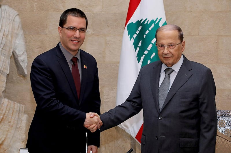 In this photo released by Lebanon's official government photographer, Dalati Nohra, Venezuelan Foreign Minister Jorge Arreaza, left, shakes hands with his Lebanese counterpart, Gebran Bassil, in Beirut, Lebanon, Wednesday, April 3, 2014. Arreaza met with Lebanonâ€™s president and foreign minister and is expected to meet with an official from the Hezbollah militant group before traveling onward to Syria. (Dalati Nohra via AP)