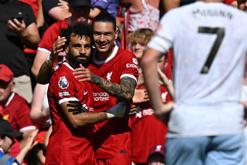 Liverpool's Mohamed Salah and Darwin Nunez celebrate after Matty Cash's own goal for Villa. AFP