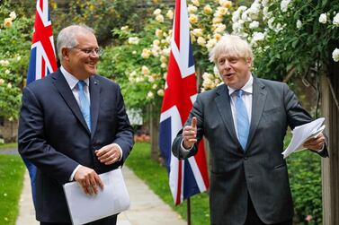 British Prime Minister Boris Johnson (R) and Australian Prime Minister Scott Morrison (L) as they announced the broad terms of a free-trade deal between their two countries. EPA.