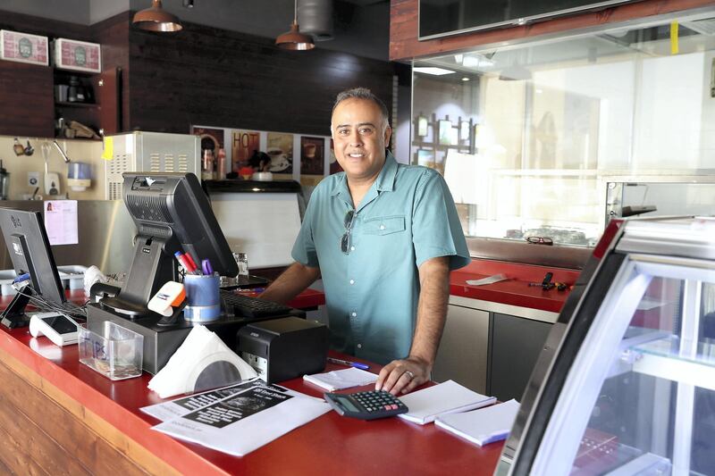 DUBAI, UNITED ARAB EMIRATES , June 18  – 2020 :- Valy Ossman at his Food shack restaurant in Al Rabia tower in Dubai. He lost Dh188,000 after falling for an online foreign currency exchange scam.  (Pawan Singh / The National) For News. Story by Nick Webster