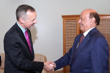 British ambassador to Yemen Edmund Fitton-Brown shakes hand with Yemen's President Abd-Rabbu Mansour Hadi (R) in 2015. 