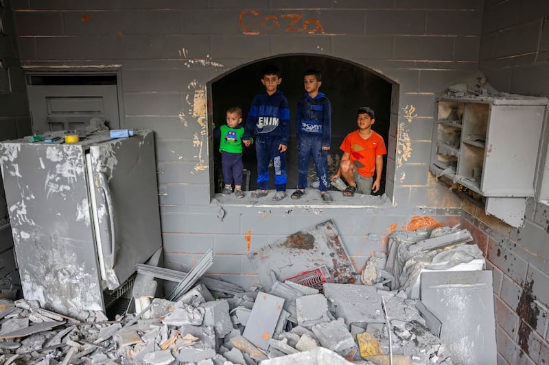 Children inside a damaged building following strikes on Rafah in the southern Gaza Strip. AFP