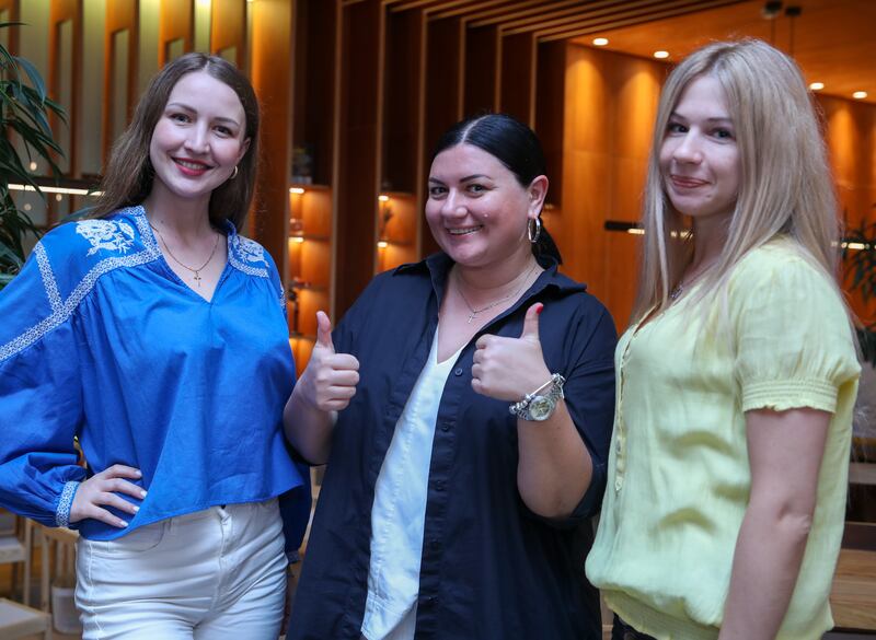 From left, Alina, Anastasiia and Ksenia are Ukrainian citizens living in the UAE. All photos: Victor Besa / The National