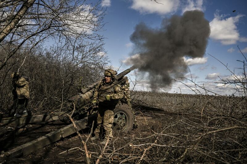 Ukrainian servicemen fire at Russian positions in the region of Donbas. AFP