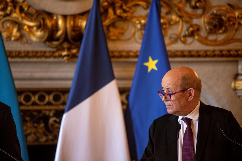 French Foreign Affairs Minister Jean-Yves Le Drian gives a press conference with his Ukrainian counterpart Dmytro Kuleba, at the Quai d'Orsay, in Paris, France, Friday, Feb. 26, 2021. (AP Photo/Rafael Yaghobzadeh)