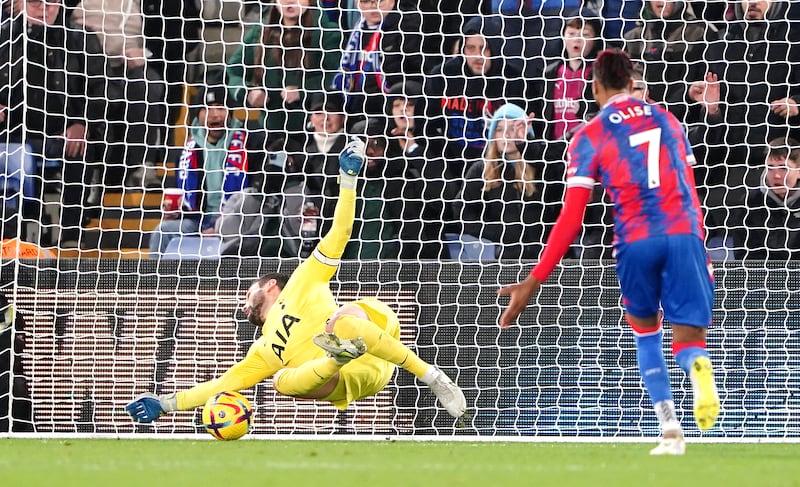 Tottenham goalkeeper Hugo Lloris saves from Palace attacker Jordan Ayew in the first half. PA