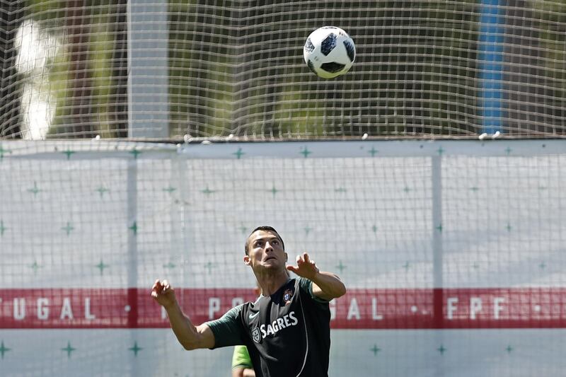 Portugal's Cristiano Ronaldo heads the ball during the training session in Kratovo, on the outskirts of Moscow, Russia, on June 17, 2018. Francisco Seco / AP Photo