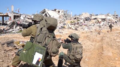 Israeli soldiers on operations among destroyed buildings in Gaza. Reuters 