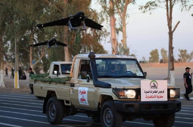 Members of Iraqi Popular Mobilisation Forces take part in a military parade in Diyala province to mark the seventh anniversary of the organisation. Reuters