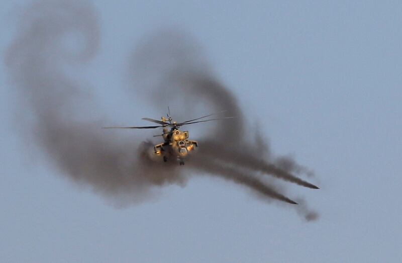 An Iraqi air force helicopter fires missiles at ISIS targets.  Reuters