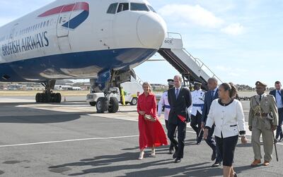 Sophie, Countess of Wessex and Prince Edward, Earl of Wessex smile as they arrive at Hewanorra International Airport. Getty
