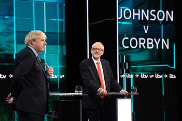 Britain's Prime Minister Boris Johnson (L) and Britain's Labour Party leader Jeremy Corbyn (R) as they debate on the set of "Johnson v Corbyn: The ITV Debate". ITV / AFP