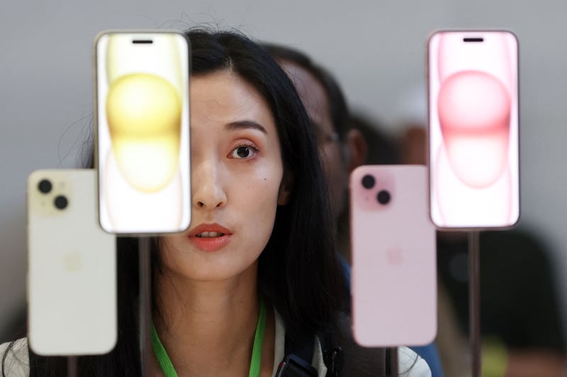 A guest looks at the brand new Apple iPhone 15 during the Apple 'Wonderlust' event on September 12 in Cupertino, California. Getty Images / AFP