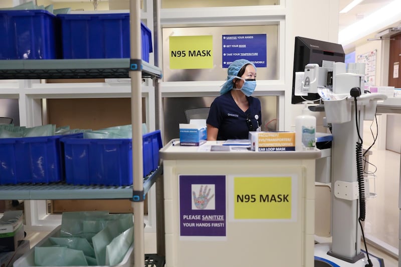 A member of medical staff wearing a protective face mask, works at an N95 face mask collection point, amid the coronavirus disease (COVID-19) outbreak, at the Cleveland Clinic hospital in Abu Dhabi, United Arab Emirates, April 20, 2020. Picture taken April 20, 2020.  REUTERS/Christopher Pike