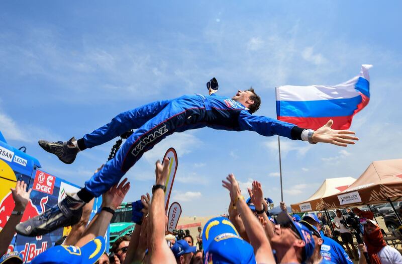 Russian Kamaz truck co-driver Evgenii Iakovle is congratulated by staff members after winning the Dakar Rally 2019, at the end of the last stage between Pisco and Lima, in Pisco Peru. AFP