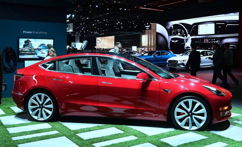 (FILES) In this file photo taken on November 29, 2018 the Tesla Model 3 is on display in Los Angeles, California at Automobility LA, formerly the LA Auto Show Press and Trade Days. Shares of Tesla Motors plunged January 2, 2019 after it reported fewer car deliveries in the fourth quarter than expected.The high-flying electric car maker, led by Elon Musk, delivered 90,700 vehicles in the fourth quarter, a bit below the 91,000 expected by analysts, even as deliveries jumped overall compared to the year-ago period. / AFP / Frederic J. BROWN
