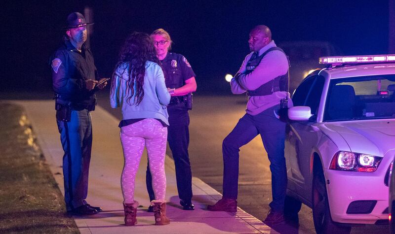 IMPD spokesperson Genae Cook speaks with a person looking for information on the people inside the FedEx building where multiple people were reportedly shot. AP Photo