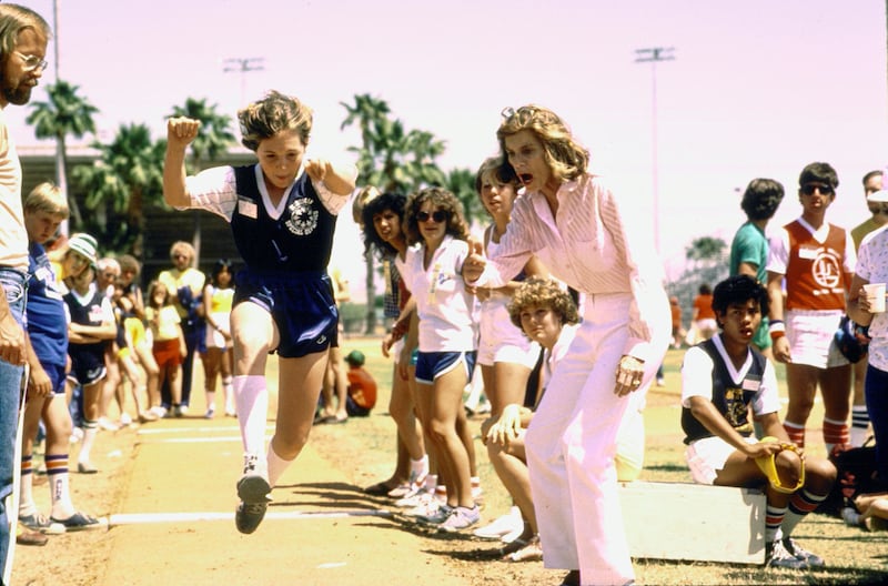 Eunice Kennedy (R) encouraging Special Olympian Karen Fosdick on her way to a gold medal.  (Photo by John Dominis/The LIFE Images Collection/Getty Images)