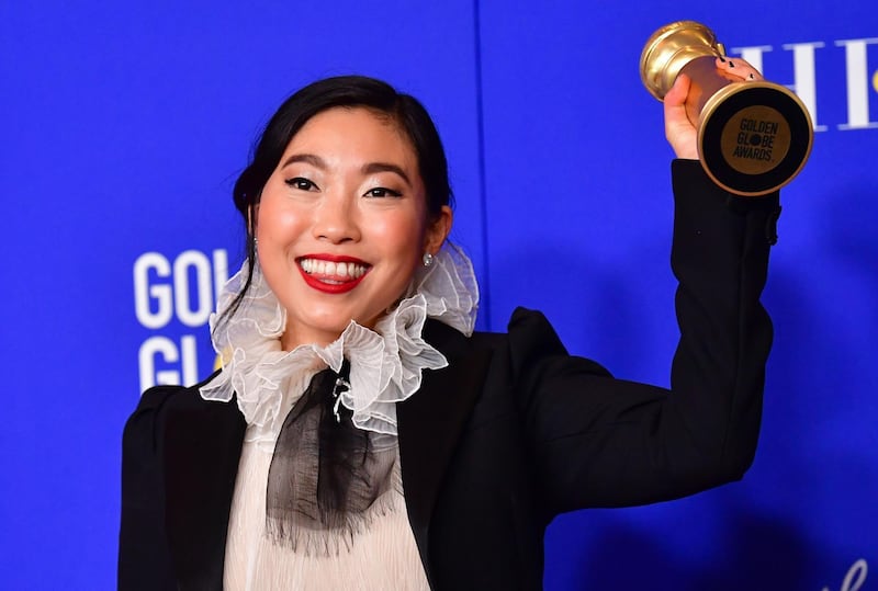 Awkwafina poses with her award for Best Performance by an Actress in a Motion Picture - Musical or Comedy for her role in 'The Farewell' during the 77th annual Golden Globe Awards on January 5, 2020, at The Beverly Hilton hotel in Beverly Hills, California. AFP