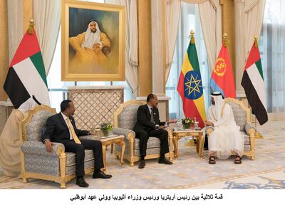 ABU DHABI, UNITED ARAB EMIRATES - July 24, 2018: HH Sheikh Mohamed bin Zayed Al Nahyan Crown Prince of Abu Dhabi Deputy Supreme Commander of the UAE Armed Forces (R), meets with HE Dr Abiy Ahmed, Prime Minister of Ethiopia (L) and HE Isaias Afwerki, President of Eritrea (C), during a reception at the Presidential Palace. 

( Mohamed Al Hammadi / Crown Prince Court - Abu Dhabi )
---