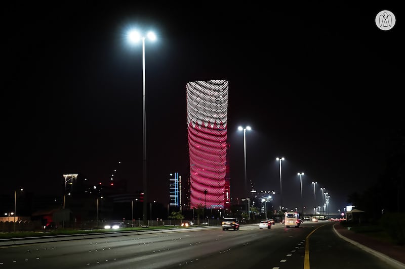 Adnec's Capital Gate building in Abu Dhabi is illuminated to mark Qatar National Day.