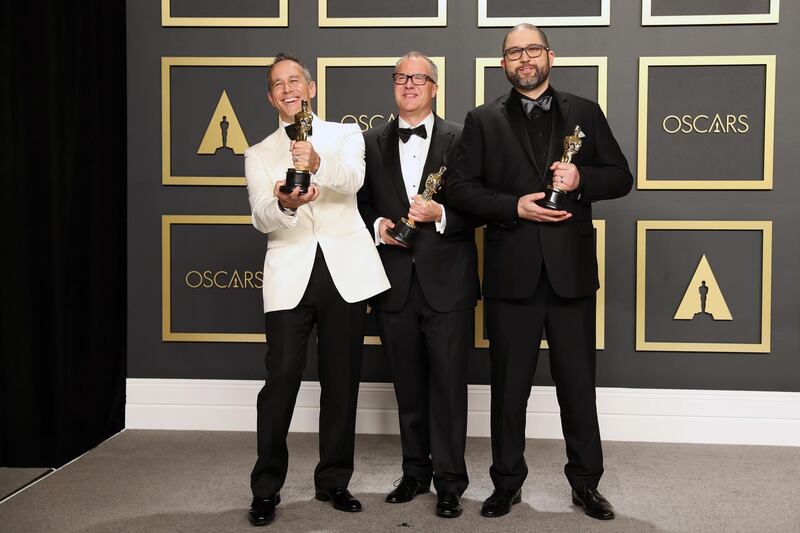 Jonas Rivera, Mark Nielsen and Josh Cooley pose in the press room with the Oscar for Best Animated Feature Film for 'Toy Story 4' at the 92nd Academy Awards on Sunday, February 9. EPA