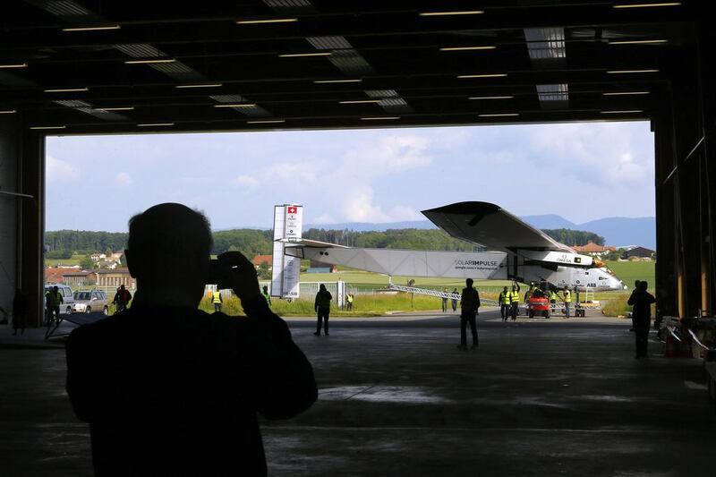 Ground crew push the 'Solar Impulse 2' back into its hangar after its maiden flight in Payerne, Switzerland, on June 2, 2014. In comparison to its size, the aircraft weighs a modest 2.3 tonnes.