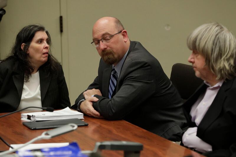 epa06451647 Louise Turpin (L) and attorney Jeff Moore (C) David Turpin (R) appear in court for arraignment on charges against the two in relation to their 13 malnourished children found chained in their home in Riverside, California, USA, 18 January 2018. The two parents were charged with multiple counts of Child abuse, torture, abuse of dependent adults and false imprisonment and could face close to 100 years to life in prison if convicted.  EPA/GINA FERAZZI / POOL  POOL PHOTO; MANDATORY CREDIT.
