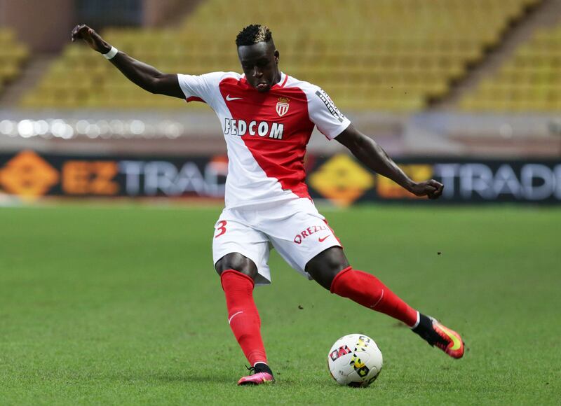 (FILES) This file photo taken on August 03, 2016 shows Monaco's Benjamin Mendy kicking the ball during the Champions League third qualifying football match between Monaco and Fenerbahce on August 3, 2016, at the Louis II stadium in Monaco. 
Monaco's French full-back Benjamin Mendy has signed a five-year contract with Manchester City, the Premier League club announced on July 24, 2017. The 23-year-old, who joined Monaco from Marseille last summer, has agreed a deal with City reported to be worth a record £52 million (58 million euros) for a defender. 
 / AFP PHOTO / Jean-Christophe MAGNENET