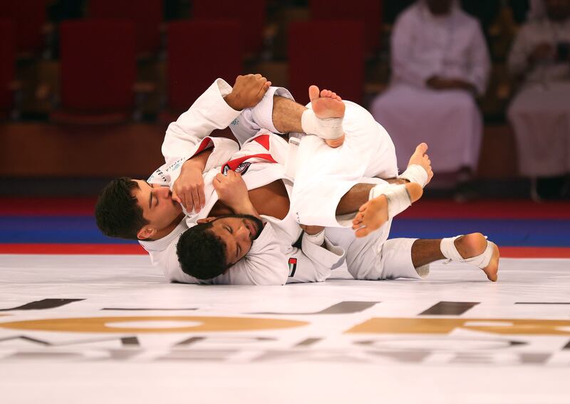 Omar Al Suwaidi (blue) beats Theyab Al Nuaimi (red) to win gold in the -56kg division.  Chris Whiteoak / The National