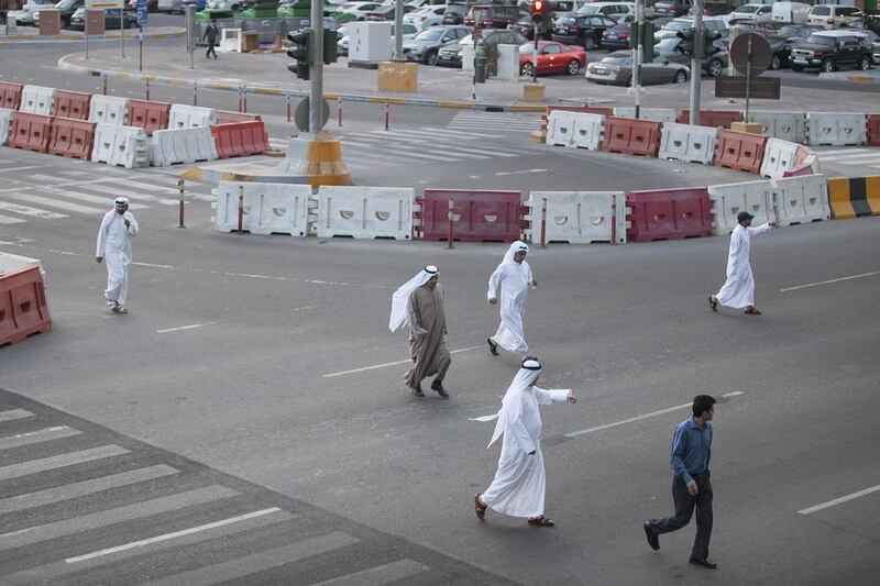 Pedestrians jaywalk rather than use the bridge across to Abu Dhabi Mall. In two hours, The National counted 1,175 pedestrians crossing the road. Mona Al Marzooqi / The National