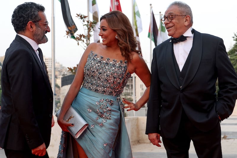 Lebanese actor Georges Khabbaz, left, Egyptian actress Bushra Rozza and film director Yousry Nasrallah at the Amman International Film Festival. All photos: AFP