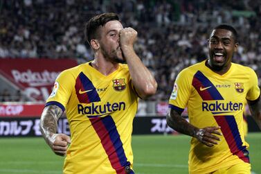 Barcelona's Charles Perez, left, celebrates the first of his two goals in Saturday's 2-0 friendly win over Vissel Kobe in Japan.