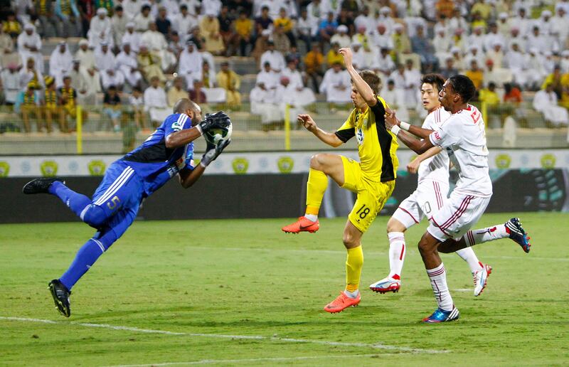 Ali Khaseif of Al Jazira gets to the ball ahead of Emiliano Alfaro of Al Wasl during the Etisalat Pro League match between Al Wasl and Al Jazira at Zabeel Stadium, Dubai on the 9th November 2012. Credit: Jake Badger for The National