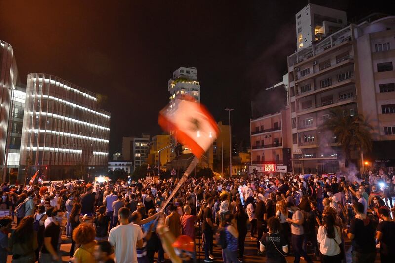 People gather in downtown Beirut to protest against economic conditions, the collapsing currency and rising prices. EPA