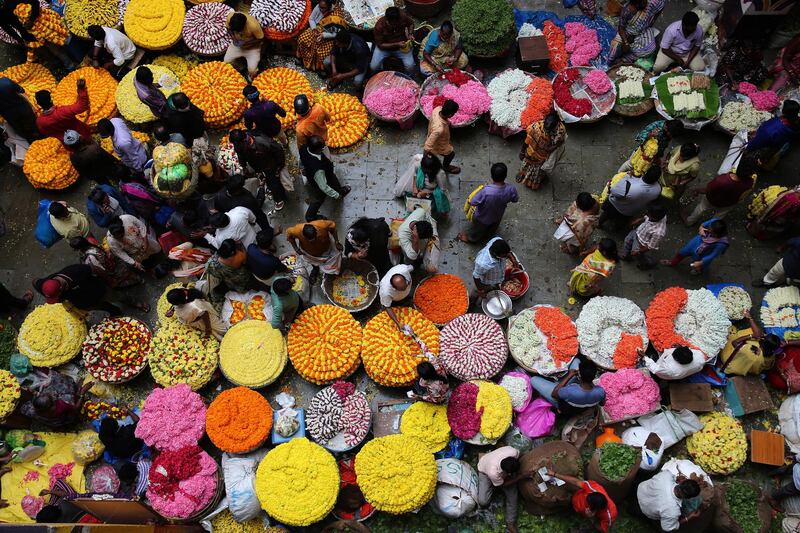 People buy flowers ahead of the Hindu Navaratri festival in Bangalore, India. EPA